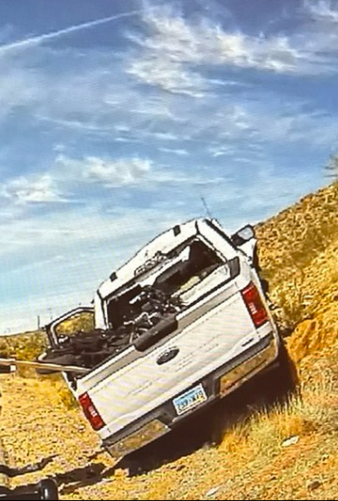 White F-150 on I-15 shoulder — Harley visible in truck bed — CHP scene documentation