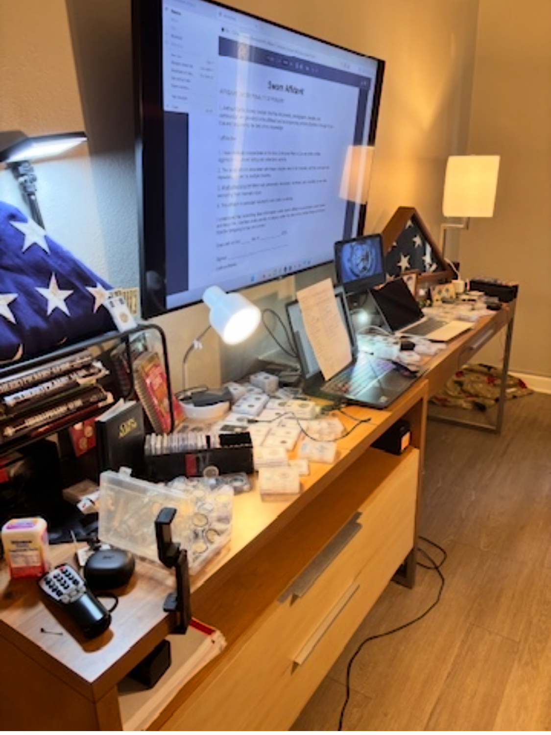 Hotel room workstation — coins — evidence — multiple devices